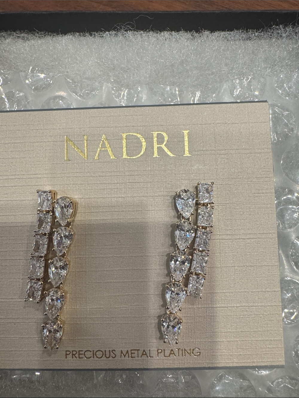 NADRI Gold Crystal Linear Earrings in precious metal